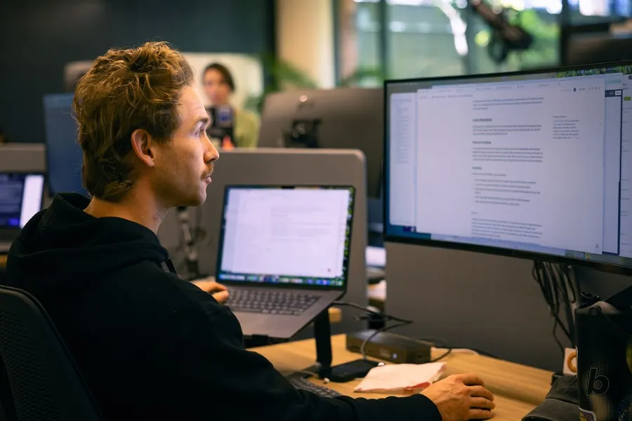 A teammate at their desk in the office